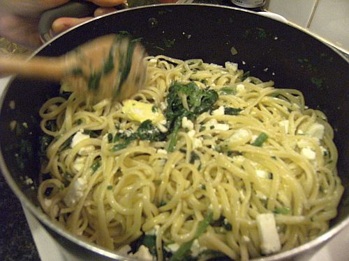 mixing pasta