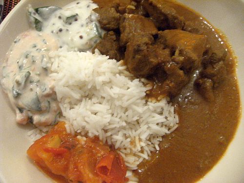 lamb curry  with raita and chutney