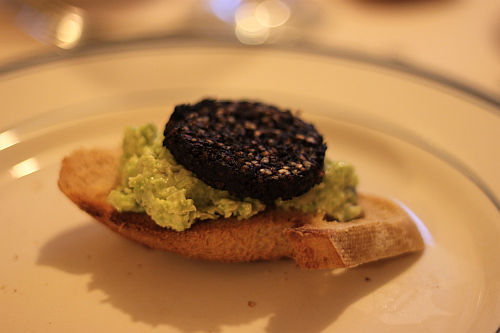 black pudding and broad bean up close